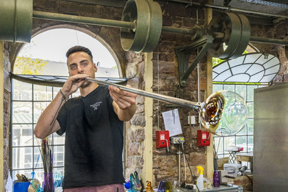 France, Moselle, Meisenthal, Centre international d'Art verrier (CIAV) (international glass centre), the glassmaker Geoffrey Richard in the blowing workshop