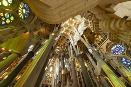 Spain, Catalonia, Barcelona, Eixample district, Sagrada Familia basilica by Catalan modernist architect Antoni Gaudi, listed as a UNESCO World Heritage Site, the transept and the interior of the Passion facade in the background