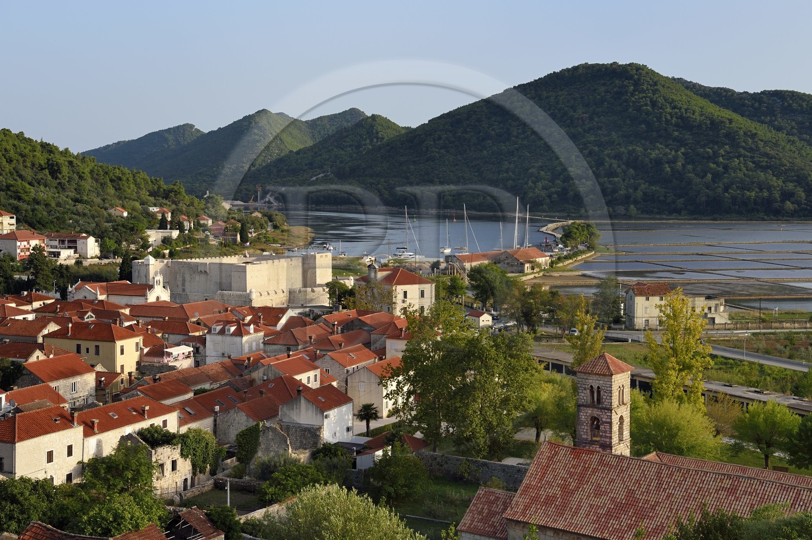 Croatia, Dalmatia, peninsula of Peljesac, the old town of Ston, Fort Kastio on the left and the Saint-Nicolas monastery on the right, the ancient salt marshes in the background