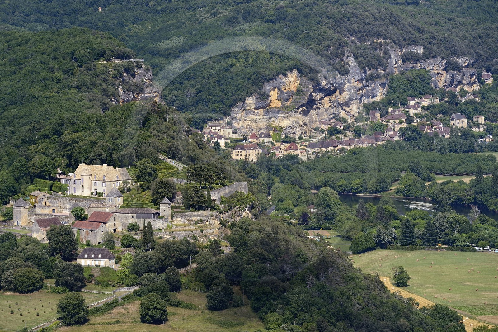 France, Dordogne, Perigord Noir, Dordogne Valley, Vezac, park and castle Marqueyssac of the 18th century, the village of La Roque-Gageac in the background (aerial view)