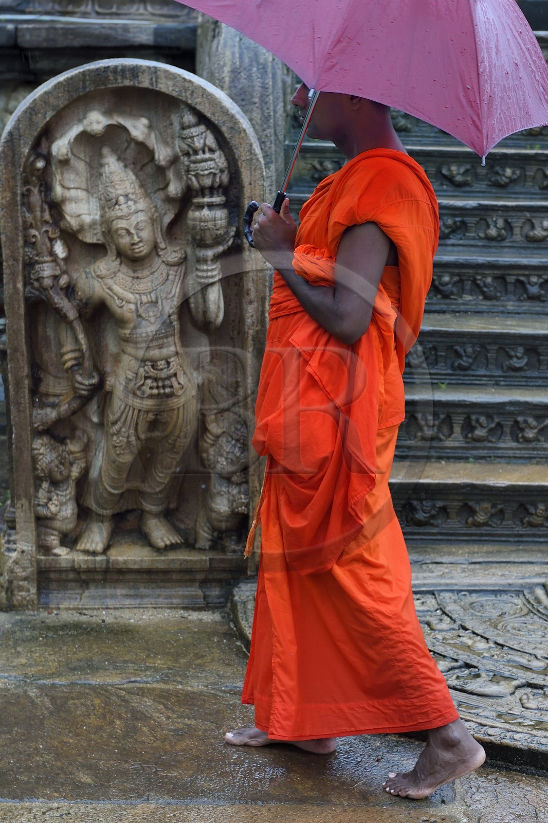 Sri Lanka,  North Central province, Polonnaruwa, the former capital of the country (11th to 13th century) listed as World Heritage by UNESCO,  terrace of the tooth's relic, monk in front of the Vatadage (relics room)