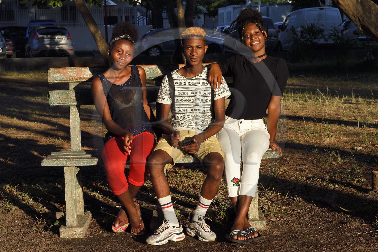 France, Mayotte island (French overseas department), Petite-Terre, Dzaoudzi, teens in discussion
