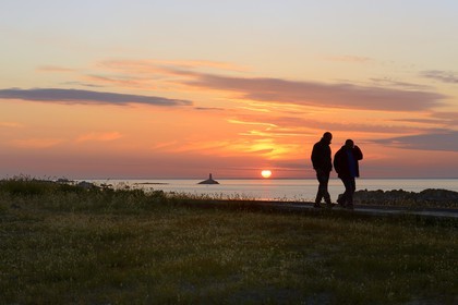 France, Finistere, La Foret Fouesnant, Glenan islands, St Nicolas Island, sunset on the west coast and the former Huic lighthouse now abandoned