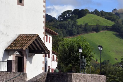 France, Pyrenees Atlantiques, Basque Country, Aldudes valley, Urepel, discussion in front of the church and the war memorial