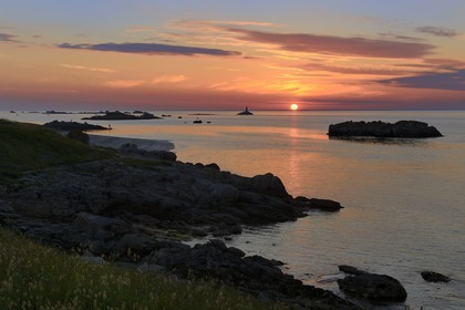 France, Finistere, La Foret Fouesnant, Glenan islands, St Nicolas Island, sunset on the west coast and the former Huic lighthouse now abandoned