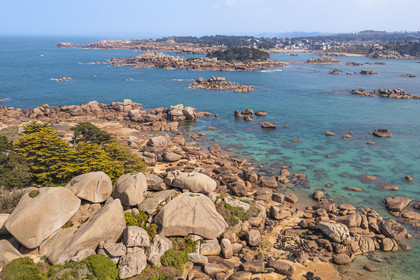 France, Cotes-d'Armor, Cote de Granit Rose, Trégastel, Renote island, the granite chaos emerges from the beach at low tide, Ploumanac'h in the background (aerial view)