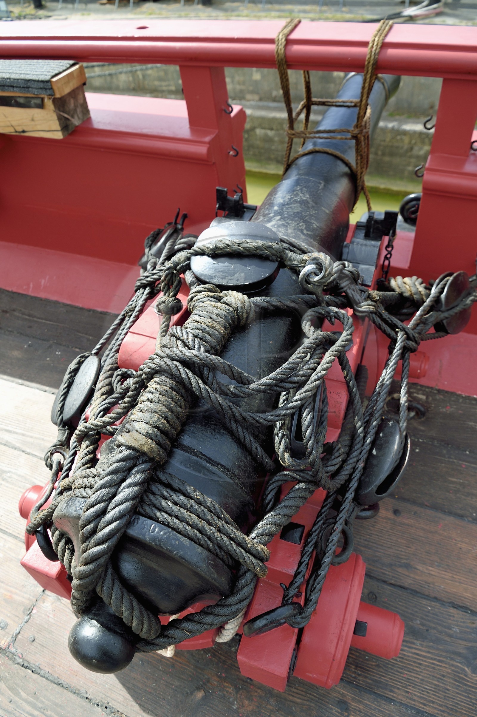 France, Charente-Maritime, Rochefort, International Center of the Sea in the former Rochefort Maritime Dock, the frigate Hermione replica of the three-master ship where the Marquis de Lafayette sailed for America in 1780, reconstruction of a 12 pounder cannon