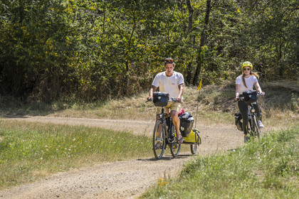 France, Maine-et-Loire, Loire valley listed as World Heritage by UNESCO, Dampierre to the east of Saumur, cycling along the banks of the Loire on the Loire à Vélo cycle path, bike with a trailer carrying camping equipment