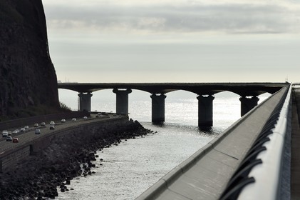 France, Reunion island (French overseas department), Saint Denis, the old national road still under the threat of rockfall and the New Coastal Route on the right ( Nouvelle Route du Littoral - NRL), 5.4 km long maritime viaduct between the capital Saint-Denis and the main commercial port to the West