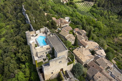 France, Vaucluse, Dentelles de Montmirail mountains, Crestet, the hilltop village of Crestet and its 9th century castle saved from ruin in the 1980s by architect Roger Anger (aerial view)