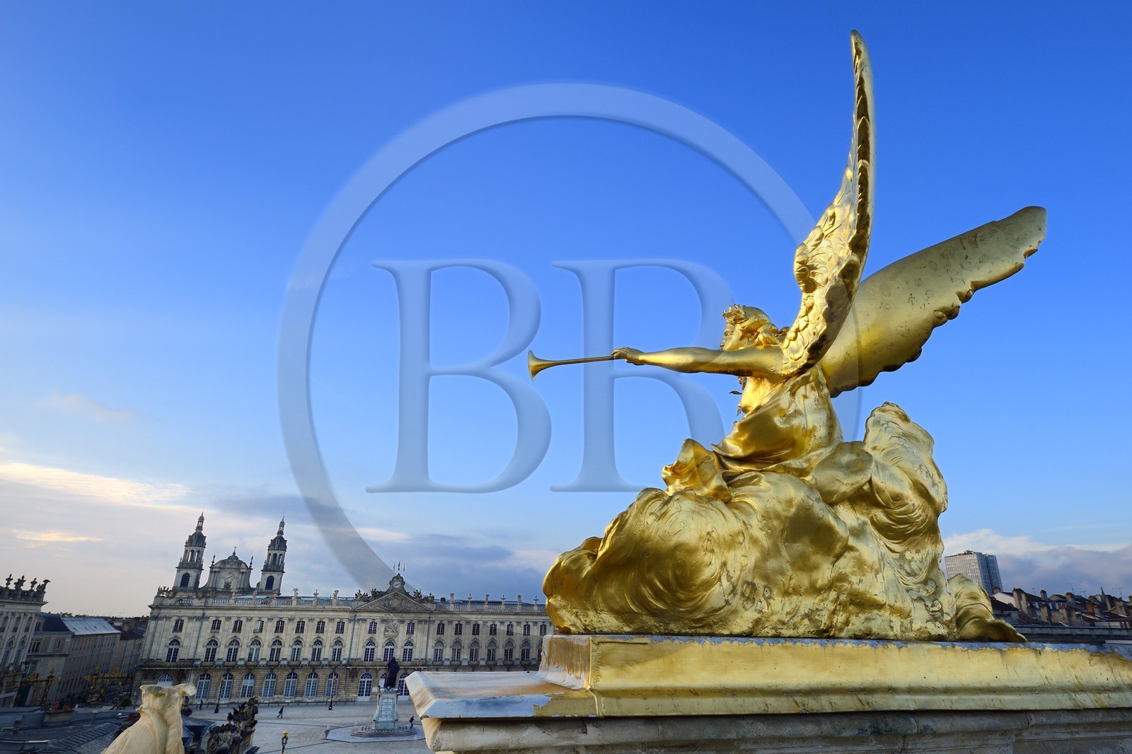 France, Meurthe-et-Moselle, Nancy, Place Stanislas (former Place Royale) built by Stanislas Leszczynski in the 18th century, listed as World Heritage by UNESCO, statue on the Triumph Arch (Here Gate), the City Hall and the Cathedral in the background