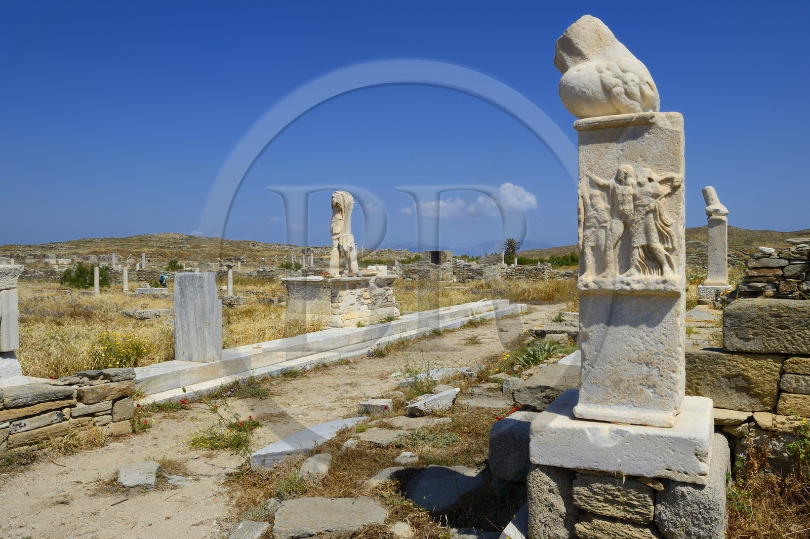 Greece, Cyclades islands, Delos, listed as World Heritage by UNESCO, the archaeological site of Delos, Apollo's Sanctuary, the most ancient city of the Aegean Sea, column with phallus at the Stoivadeion