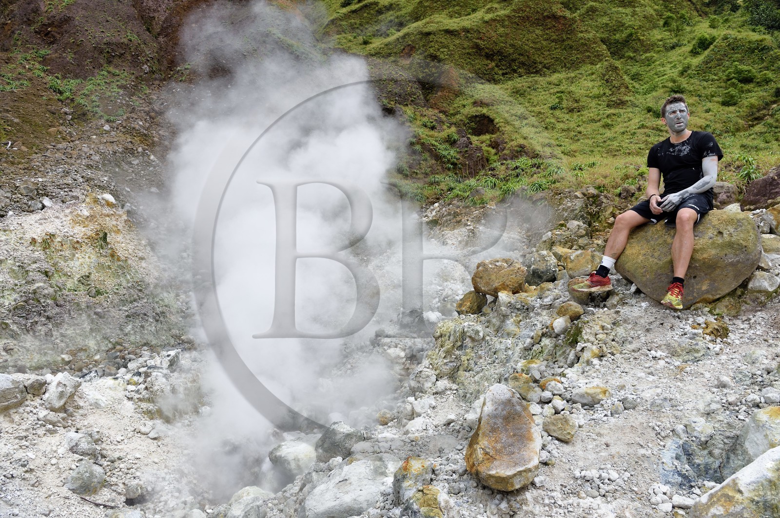 Caribbean, Dominica Island, Castle Bruce, Morne Trois Pitons National Park listed as World heritage by UNESCO, Valley of Desolation, hiker on the trail to Boiling Lake with a pure clay mask from the river of hot springs whose unique color is due to the presence of calcium, carbon, sulfur and iron