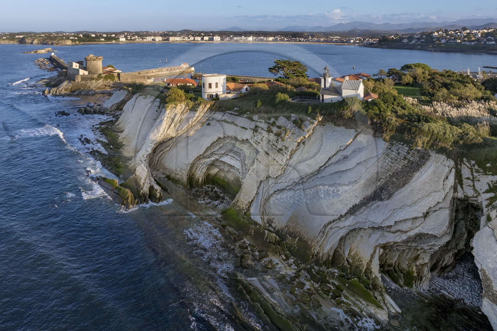 France, Pyrenees Atlantiques, Basque Country coast, the Basque Corniche, Urrugne, flysch cliffs and the fort of Socoa protecting the bay of Saint-Jean-de-Luz in the background (aerial view)