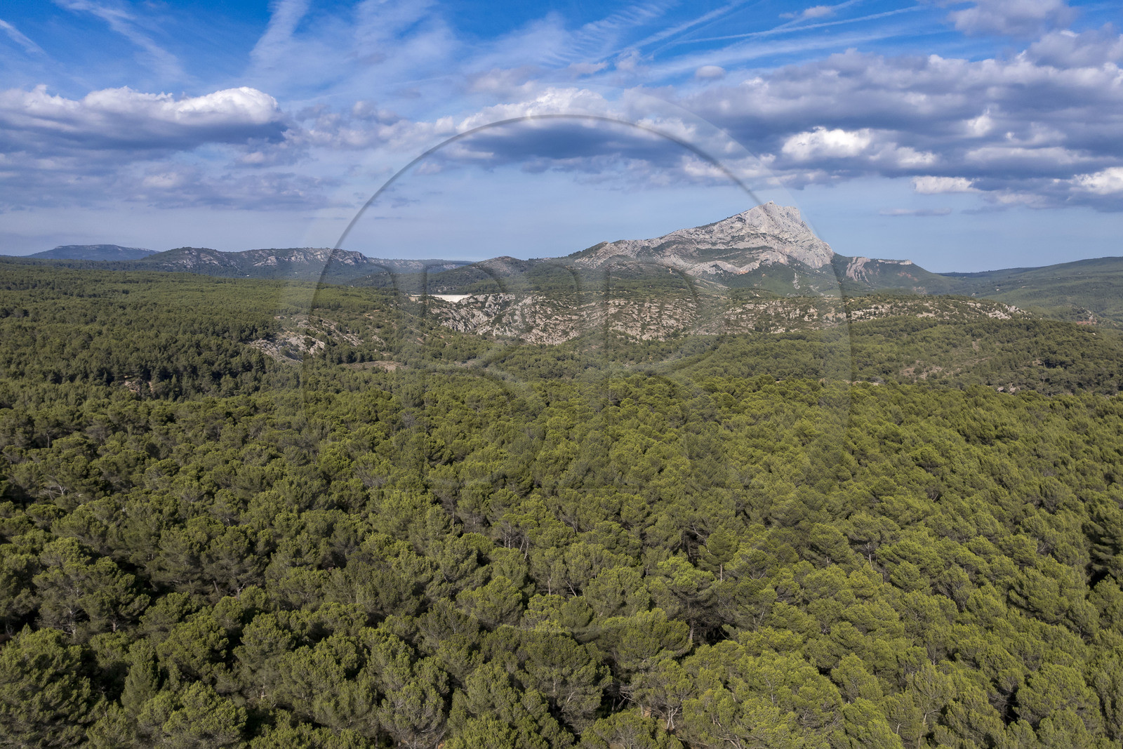 France, Bouches du Rhone, Aix en Provence, the forest on Bibemus plateau and the Sainte Victoire mountain in the background (aerial view)