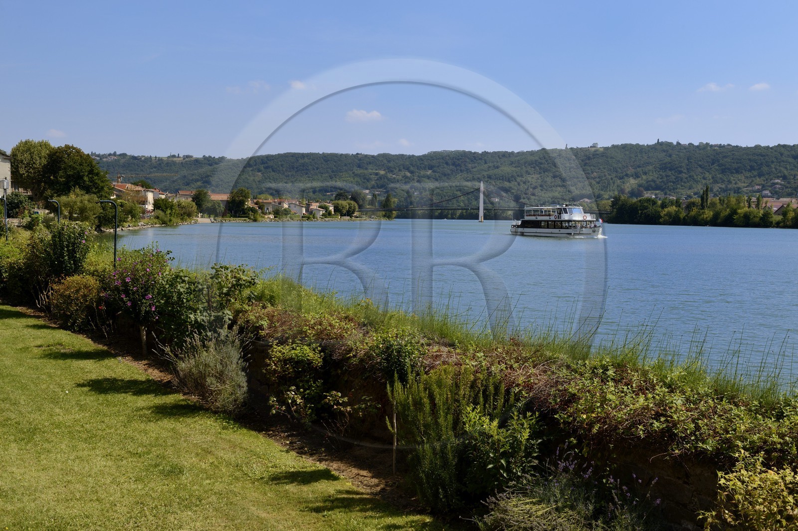 France, Rhone, Condrieu, small cruise boat on the Rhone seen from the Hotel Restaurant Le Beau Rivage