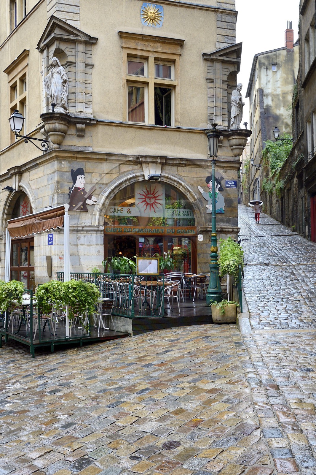 France, Rhone, Lyon, historical site listed as World Heritage by UNESCO, Vieux Lyon (Old Town), Saint George district, the place de la Trinite with the Café du Soleil served as the backdrop for the puppeteers putting on Guignol shows, and the montee du Gourguillon on the right