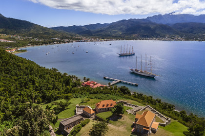 Caribbean, Dominica Island, Portsmouth, Cabrits National Park, Fort Shirley, 18th century British fort, the Royal Clipper and the Star Flyer of the Star Clipper company in Prince Rupert Bay (aerial view)