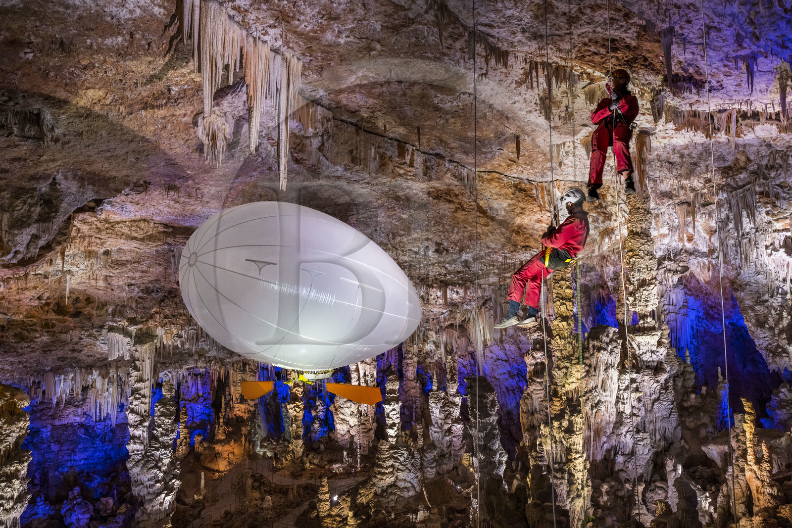 France, Gard, Mejannes-le-Clap, grotte de La Salamandre (Salamander cave), abseiling and discovery of the cave in Aéroplume®, an individual dirigible balloon inflated with helium which allows you to fly away by flapping your wings