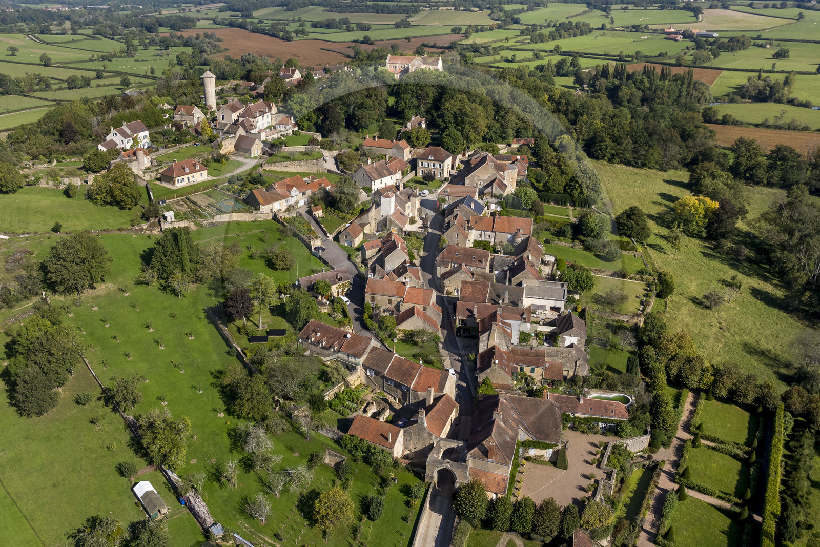 France, Yonne, Montreal (Burgundy), the village overlooked by the 12th century Romanesque Notre-Dame collegiate church (aerial view)
