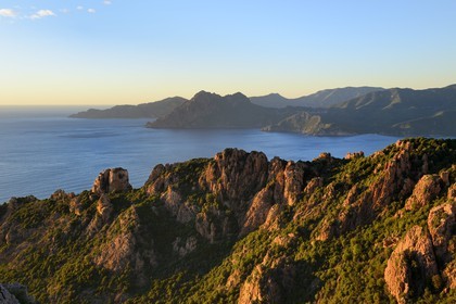 France, Corse du Sud, Golfe de Porto, listed as World Heritage by UNESCO, the Creeks of Piana (Calanches de Piana) with pink granite rocks, the Capo Senino and the Scandola peninsula Nature Reserve in the background