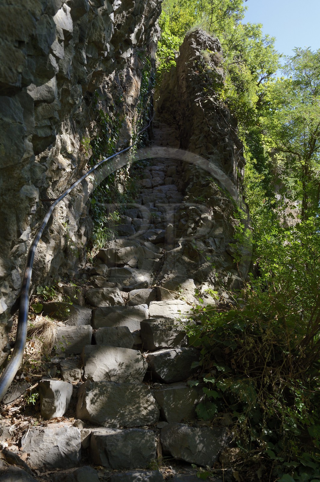 France, Ardeche, Monts d'Ardeche Regional Natural Park, Thueyts,  staircase carved into the rock between the Ardeche River and the village