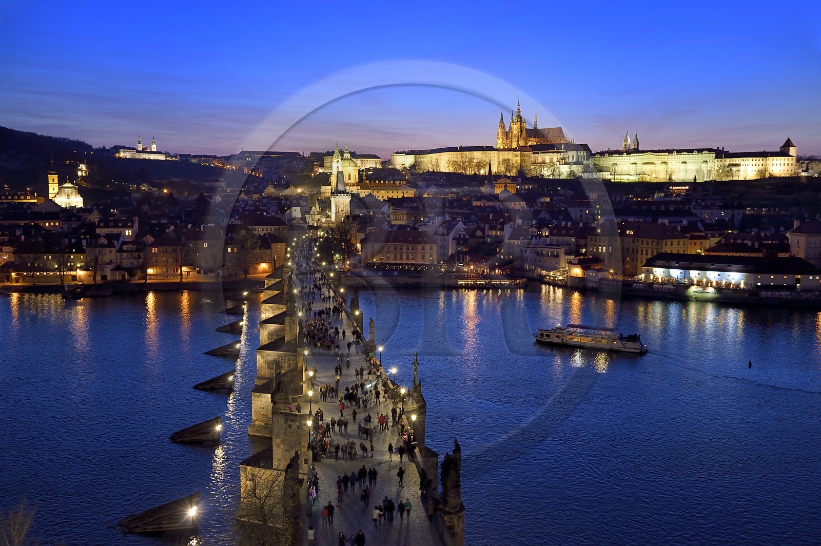 Czech Republic, Prague, historical centre listed as World Heritage by UNESCO, the Charles Bridge over Vltava River, the Gothic tower at the entrance of the bridge on the side of Mala Strana district in front of Saint Nicolas Church and the Royal castle in the background right