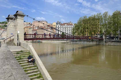 France, Rhone, Lyon, historical site listed as World Heritage by UNESCO, Quai Bondy, the Saint Vincent Footbridge over the Saone River and the Croix Rousse District in the background