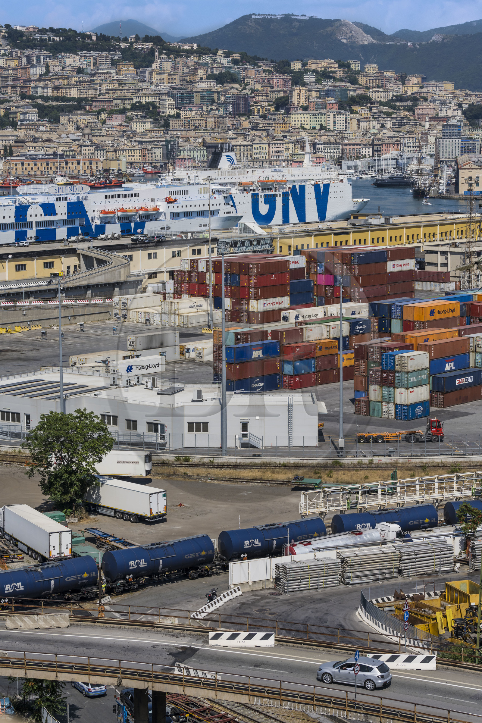 Italy, Liguria, Genoa, the container terminal of the commercial port, the ferry terminal and the city in the background