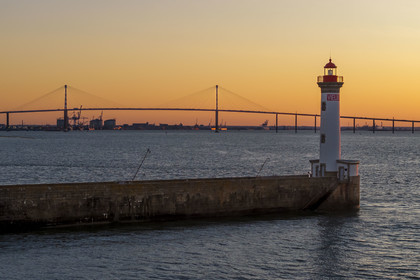 France, Loire-Atlantique, Saint-Nazaire, the Vieux Mole lighthouse and the Saint Nazaire bridge in the background (aerial view)