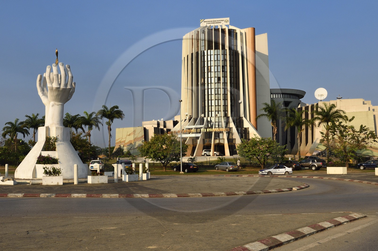 Gabon, Libreville, boulevard Triomphal El Hadj Omar Bongo, the Flame of Peace sculpture in front the Ministry of Petroleum