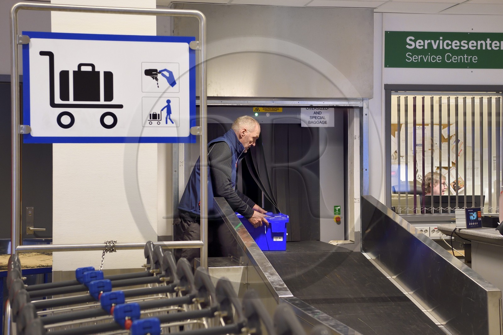 Norway, Svalbard, Spitzbergen, Longyearbyen, Svalbard Global Seed Vault (Seed Bank), arrival and scanning of seeds at the airport baggage claim area performed by NordGen