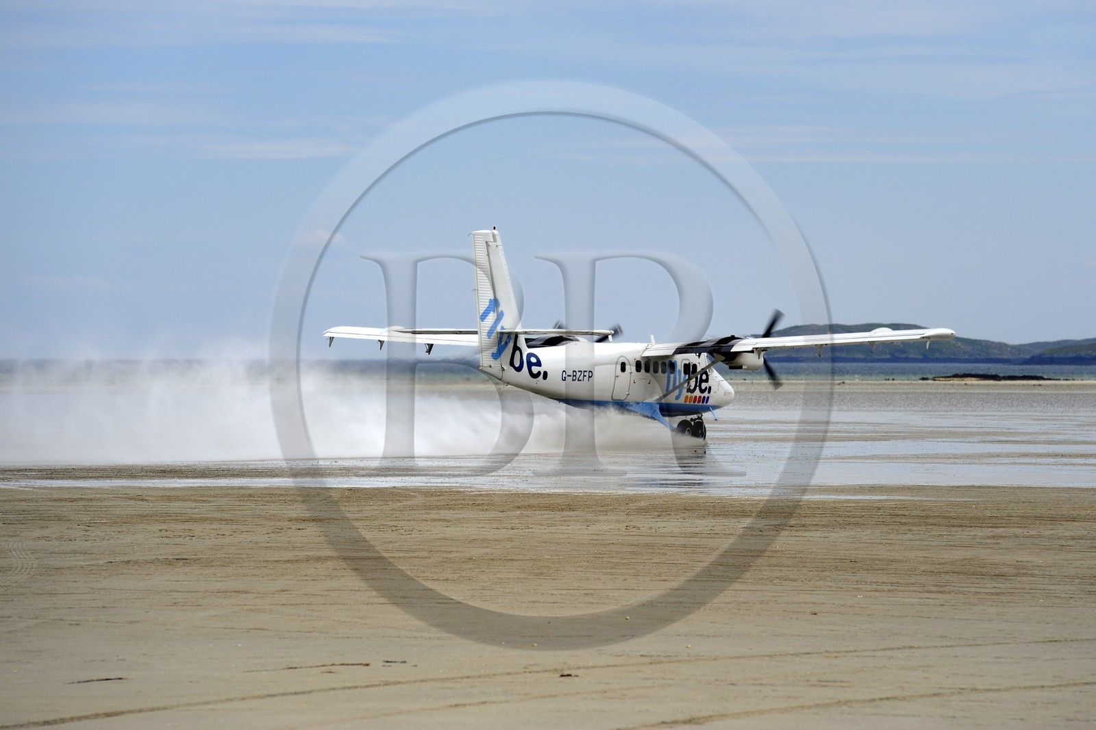 United Kingdom, Scotland, Outer Hebrides, Isle of Barra, Twin Otter Taking off From Barra Airport, the runway is the beach at low tide