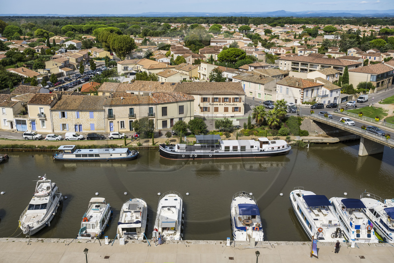 France, Gard, Aigues Mortes, the port of the Rhone to Sète canal at the foot of the ramparts of the old town