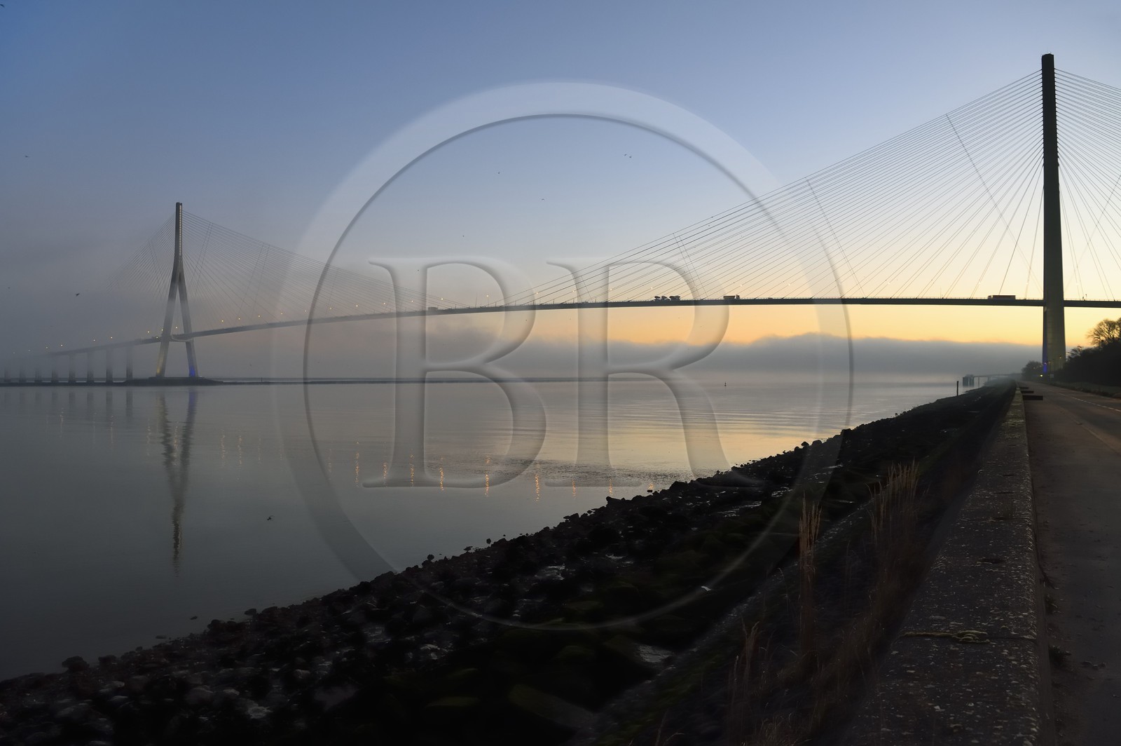 France, between  Calvados and Seine Maritime, the Pont de Normandie (Normandy Bridge) in the mists of dawn, it spans the Seine to connect the towns of Honfleur and Le Havre
