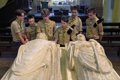 France, Allier (03), former province of Bourbonnais, Souvigny, the cluniac priory church of Saints Peter and Paul (prieuré Saint-Pierre-et-Saint-Paul), ducal necropolis of the Dukes of Bourbon, scouts of Europe around the recumbent statues of two illustrious abbots of Cluny who became Saint Mayeul and Saint Odilon