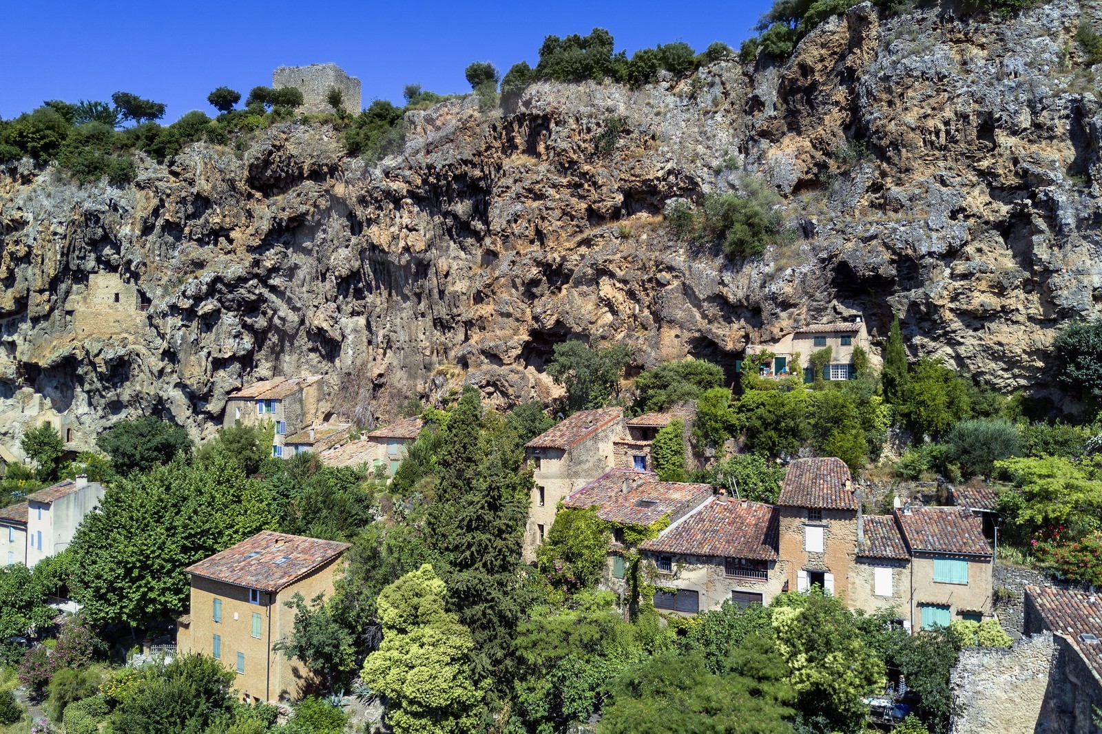 France, Var, Provence Verte, Cotignac, troglodyte habitat in the tufa cliff of 80 meters high and 400 meters wide (aerial view)