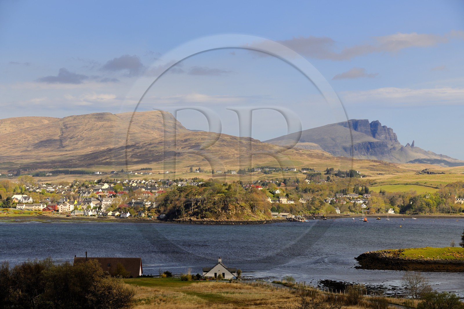 United Kingdom, Scotland, Highlands, Hebrides, Isle of Skye, Trotternish, harbour of Portree and the rocks of Storr in the background