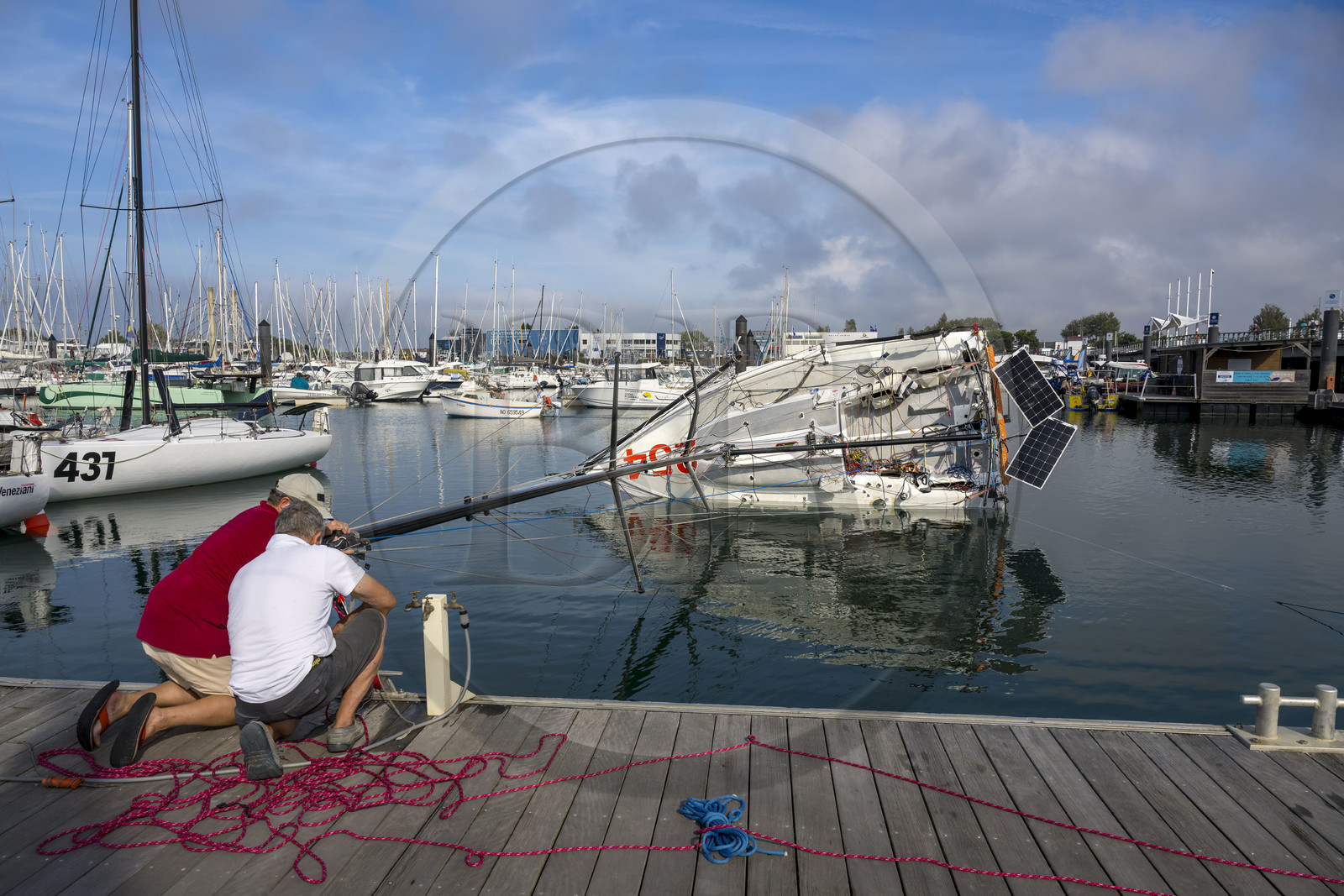 France, Vendee, Les Sables d'Olonne, Port Olona, Vendée Globe sailboat pontoon, Mini 6.50 class monohull regatta sailing boat preparing to participate at the minitransat