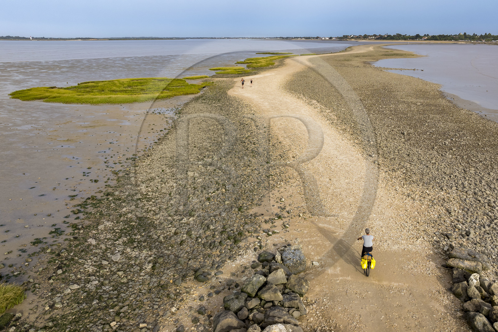France, Charente Maritime, Port-des-Barques, cyclist on a hike,  the tombolo of Passe aux Boeufs which connects Ile Madame to the continent (aerial view)