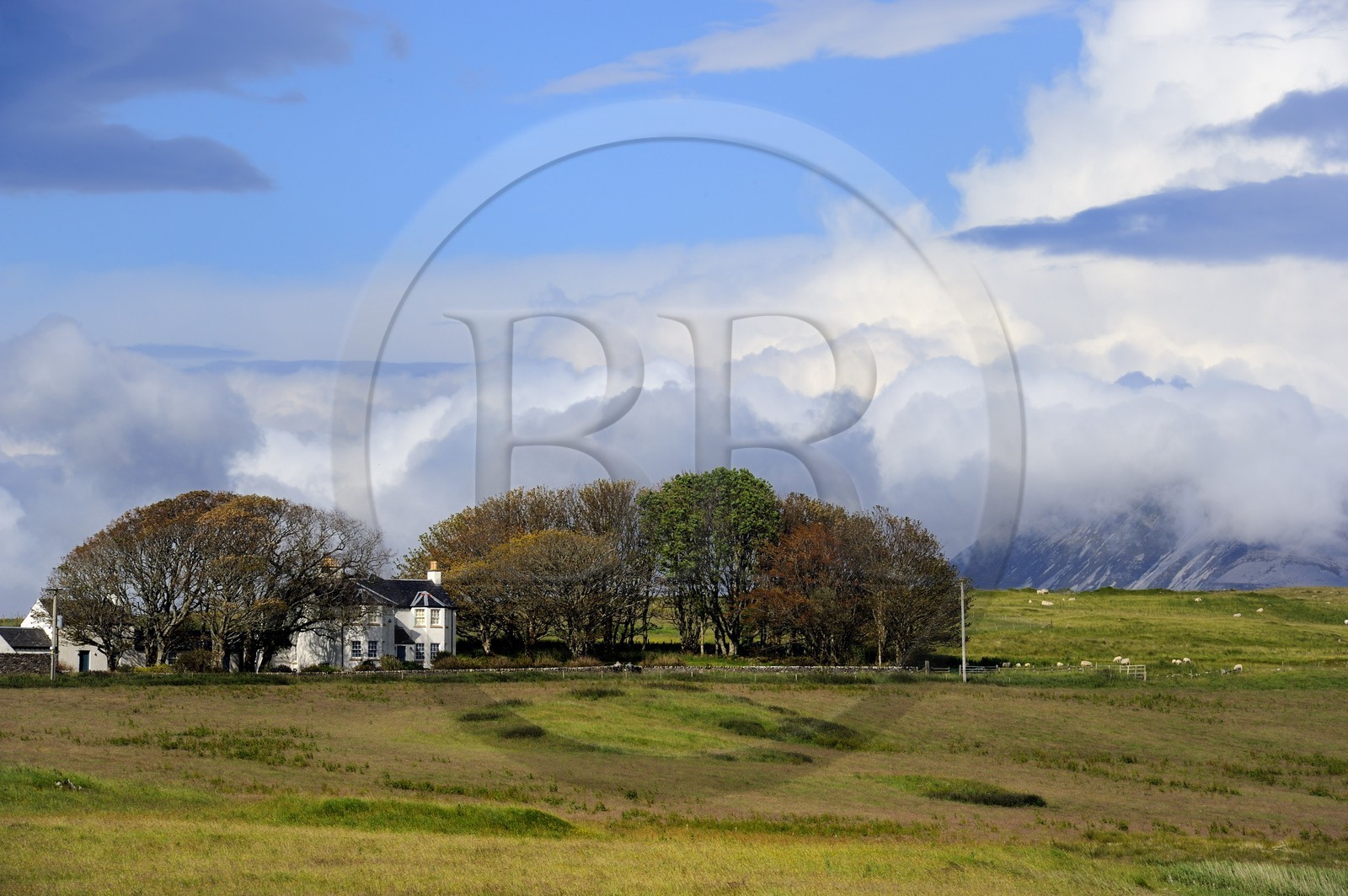 United Kingdom, Scotland, Inner Hebrides, Islay Island, house on the edge of Loch Finlaggan and the mountains of the island of Jura in the background