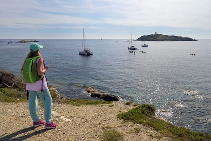 France, Var, Six Fours les Plages, Ile des Embiez, hiker at cape Saint Pierre, Grand Rouveau Island in the background