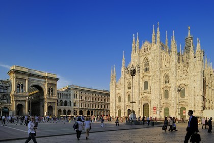 Italy, Lombardy, Milan, Piazza del Duomo, entry of Vittorio Emmanuel II Gallery, shopping arcade built on the 19th century by Giuseppe Mengoni and the Duomo Gothic style cathedral in the historical center