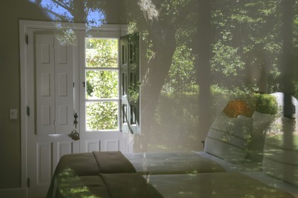 Argentina, Buenos Aires Province, San Antonio de Areco, estancia La Bamba de Areco, hotel room and reflection of the garden