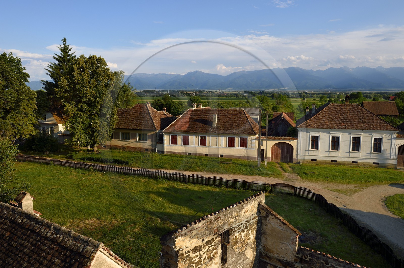 Romania, Transylvania, Cincsor village and the Fagaras Mountains in the Southern Carpathians in the background