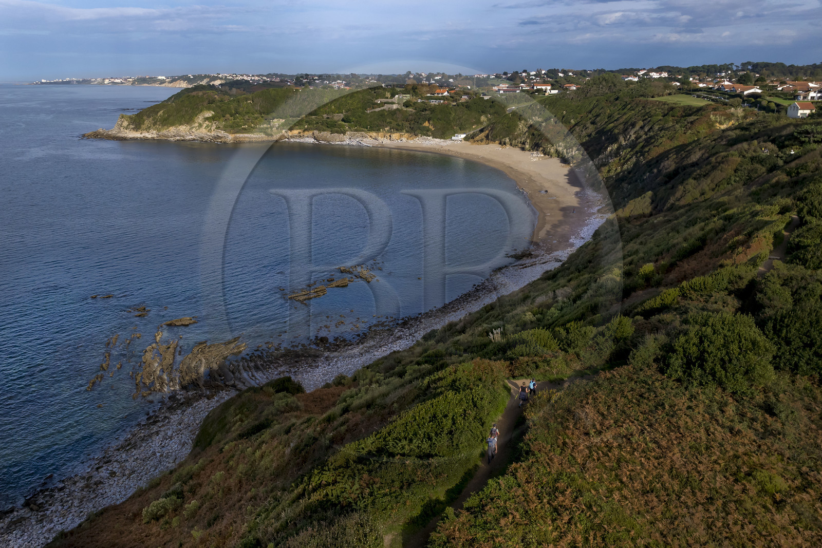 France, Pyrenees Atlantiques, Basque Country coast, Saint-Jean-de-Luz, the coastal path on the GR 8 overlooking Lafitenia beach and the coast between Guéthary and Biarritz in the background (aerial view)