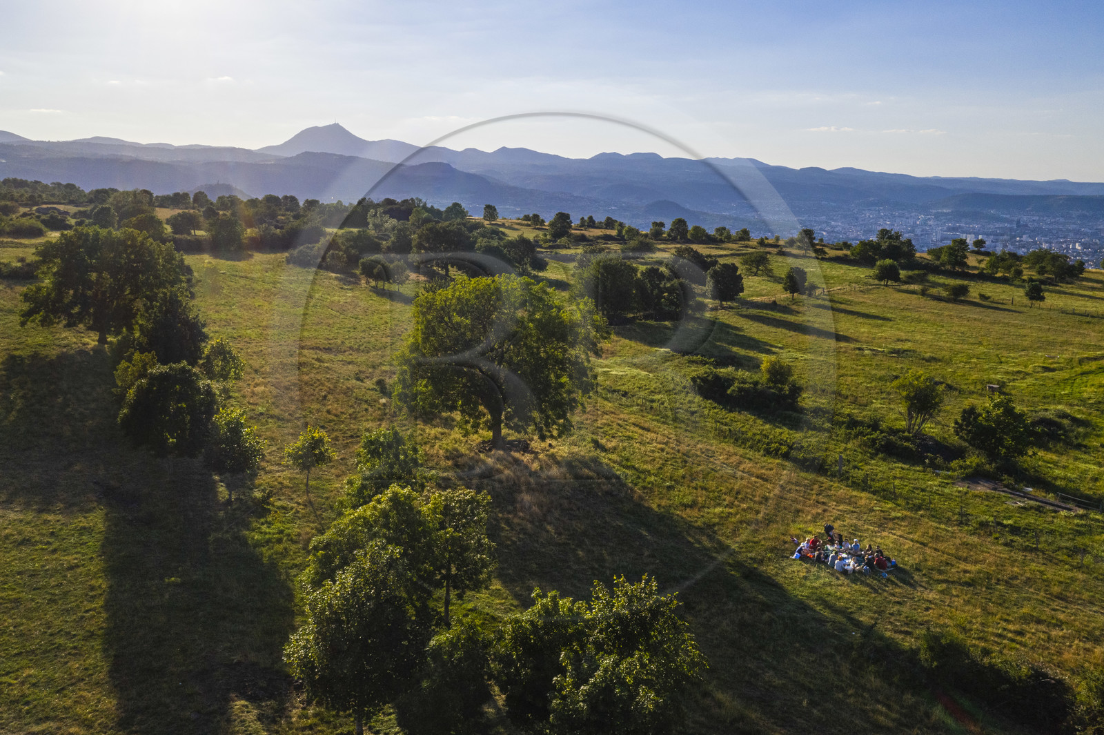 France, Puy de Dome, Gergovie Plateau, historic site of the battle between the Averni and the Romans of Caesar in 52 BC, the Chaîne des Puys, a UNESCO World Heritage Site, with the Puy de Dôme volcano in the background (aerial view)