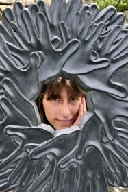 France, Var, Verdon Regional Natural Park, Bargeme village, labelled Les Plus Beaux Villages de France (The Most Beautiful Villages of France), the artist Elsa Leroy in front of her workshop