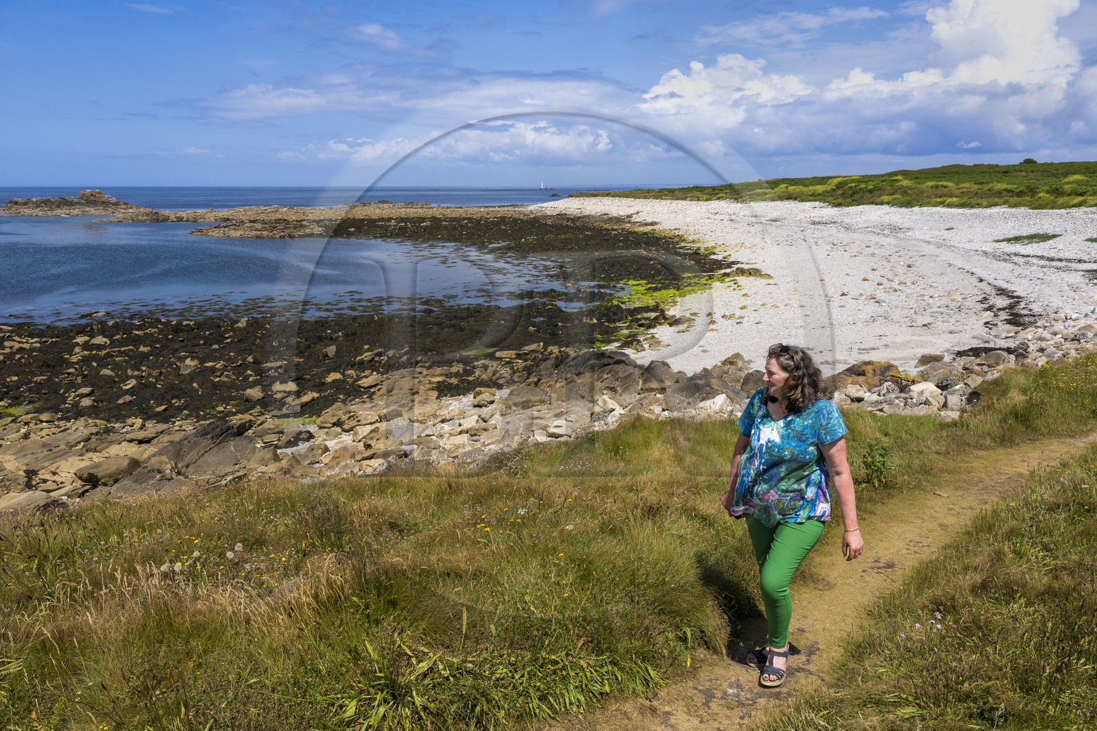 France, Finistère, Iroise Sea, Molene Island, Christine Demeure who manages the only grocery store on the island during her daily walk on the wild west coast, Roelen shore