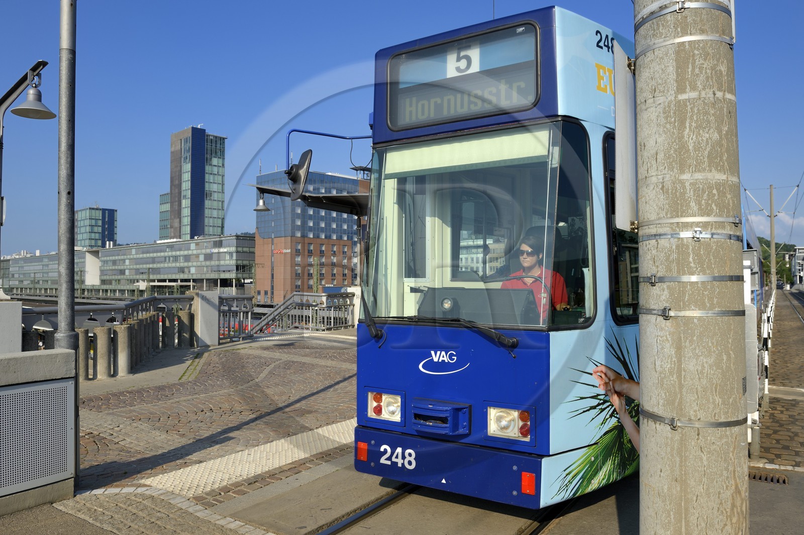 Germany, Baden-Wurttemberg, Freiburg im Breisgau, tram at Central Station and solar tower